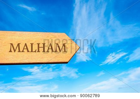 Wooden arrow sign pointing touristic destination