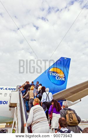 People Board The Flight Home