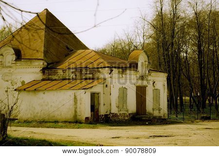 Small ruined brick shop in the Russian province
