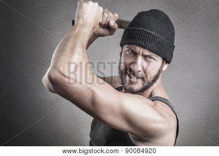 Violent Man Using A Spanner Or Wrench As A Weapon