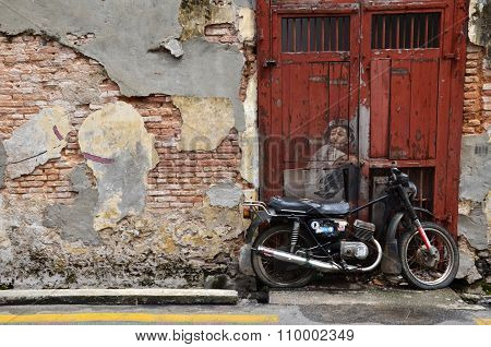 Street Mural Entitled Boy On A Bike  By Ernest Zacharevic In Penang.