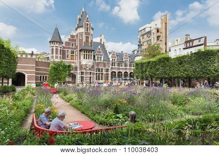 Visitors Resting In A Garden At The Zoo Of Antwerp