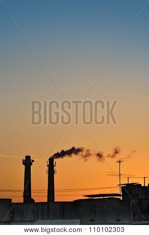 Silhouette Of Industrial Production, Polluting The Atmosphere