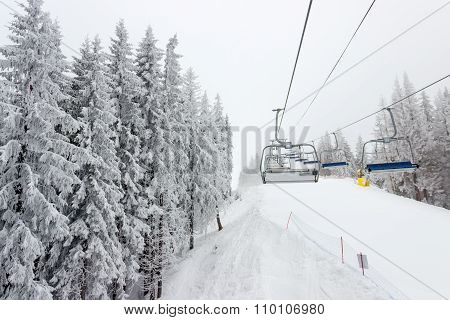 Chairlift And Ski Piste In Cloudy Weather