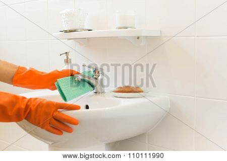 Woman Cleaning Water Tap