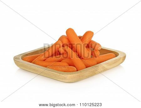 Babay Carrots In Wooden Plate On White Background