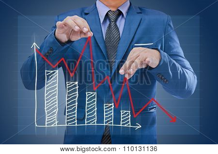 business man try to bring graph up business concept