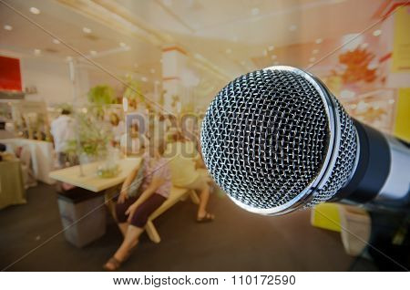 silver color of microphone with blurred event background