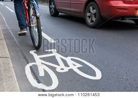 Man On Bike Using Cycle Lane As Traffic Speeds Past