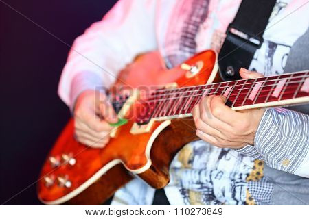 Woman Is Playing A Guitar