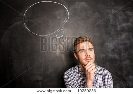 A Student In A Checked Shirt Thinks Over
