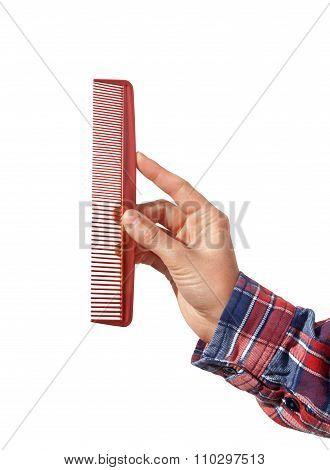 Comb In The Hand Isolated On White Background