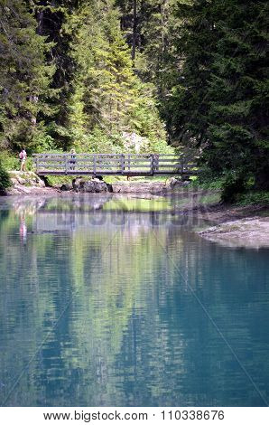 A wooden bridge over the braies Lake