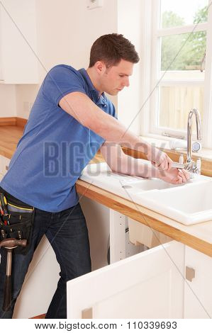 Plumber Fixing Tap With Adjustable Wrench