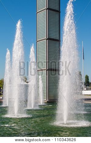 Water Spray In Fountain Near Business Buildings