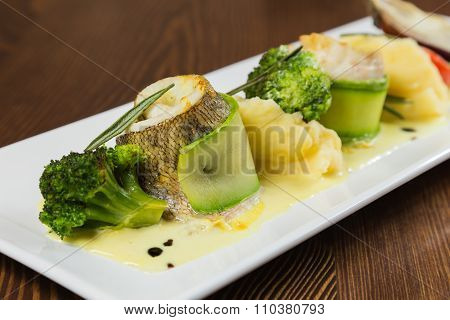 Fish with vegetables. Beautiful layout on a plate
