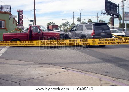 LONG BEACH, CALIFORNIA- DECEMBER 3, 2015: A High Speed Police Chase ends as the suspect car collides at an intersection with another car. Long Beach, California Dec. 3 2015