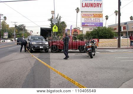 LONG BEACH, CALIFORNIA- DECEMBER 3, 2015: A High Speed Police Chase ends as the suspect car collides at an intersection with another car. Long Beach, California Dec. 3 2015