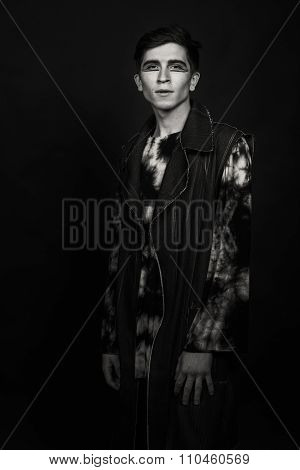 Young, handsome male actor. Actor in theatrical makeup. Emotional game male actor.