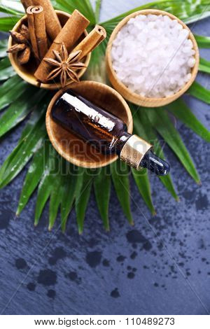 Beautiful spa setting on palm leaf on grey background
