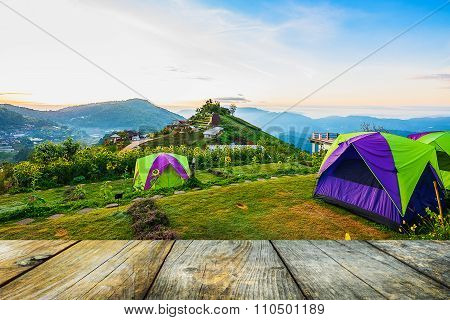 wood floor on mountain and sunrise
