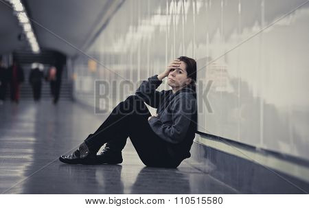 Young Sad Woman In Pain Alone And Depressed At Urban Subway Tunnel Ground Worried Suffering Depressi