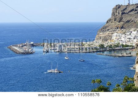 PUERTO DE MOGAN - NOVEMBER 26: Aerial view of old town and marina Puerto de Mogan on 26 November 2015 in Puerto de Mogan, Gran Canaria Island. This is popular winter tourist destination from Europe.