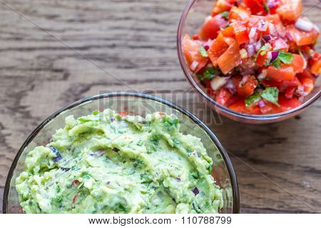 Bowls Of Guacamole And Salsa