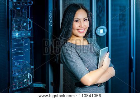 Engineer businesswoman in network server room