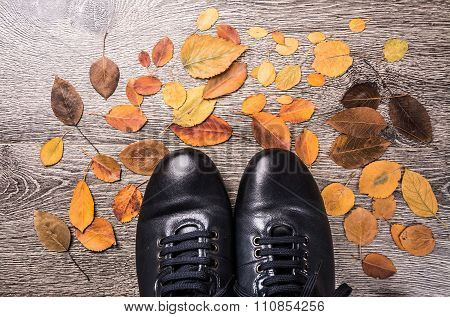 Blue boots on the ground.