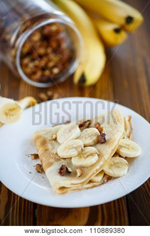 sweet pancakes with bananas and nuts