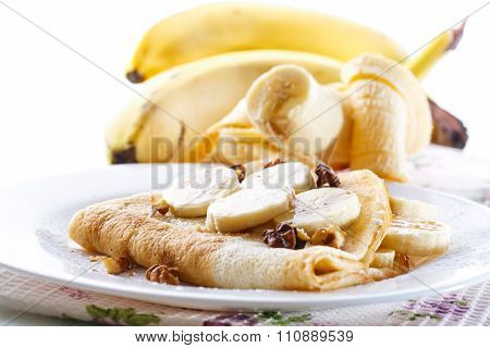 sweet pancakes with bananas and nuts