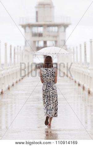 Woman And Umbrella Walking On Jett Bridge In Raining Day