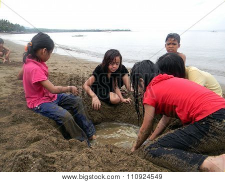 Children Playing at a Beach