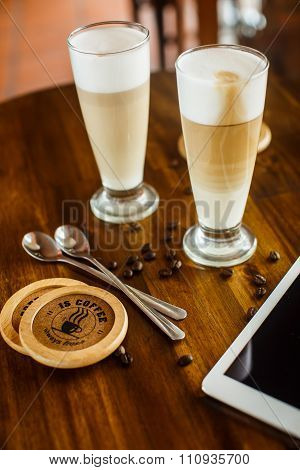 2 Latte On A Wooden Table