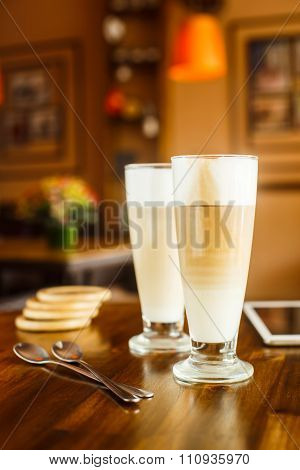 2 Latte On A Wooden Table