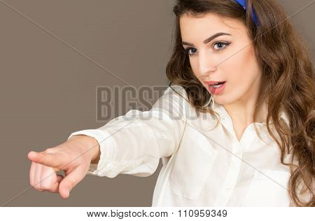 The Young Woman Points A Finger