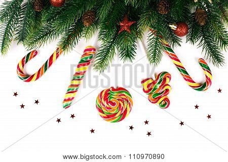 Christmas tree branches with decoration and candy