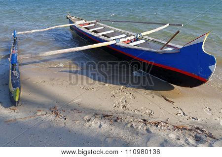 Belo, Madagascar, November 24, 2015 : Traditional Fisherman Pirogue On The Beach. The Outrigger Cano