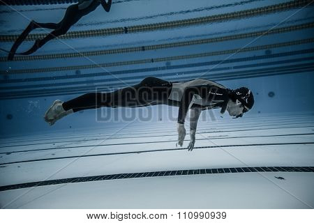 Dynamic No Fins Freediver During Performance From Underwater