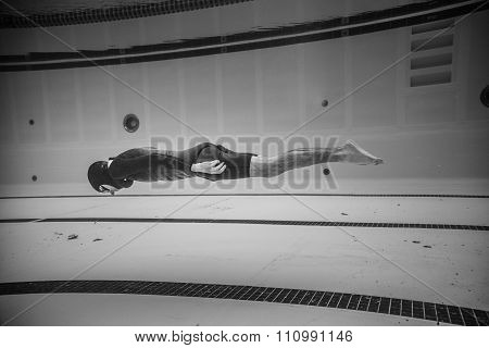 Dynamic No Fins Freediver During Performance From Underwater