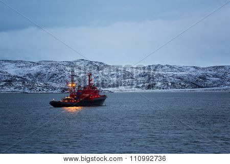 Fishing Boat With Lighted Mast Lights In The Barents Sea In The Winter Polar Day