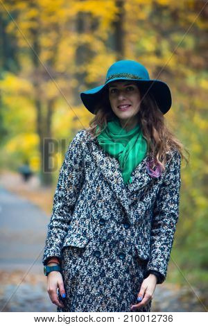Pretty Romantic Girl In Autumn Clothes Walks In A Park. The Mood Of Autumn, Leaf Fall.