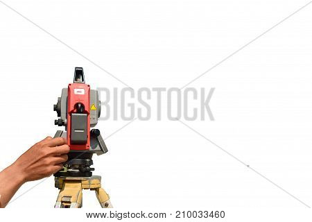 Modern surveyor equipment theodolite or tacheometer used in surveying and building construction for precise measurement. Total station outdoor at construction site. Copy space