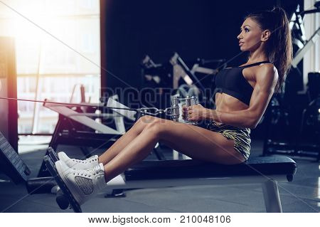 Sexy Athletic Young Girl Training Back In Gym