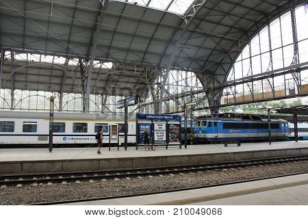 Czechia People And Foreigner Passengers Wait And To Get On The Train At Prague Main Railway Station
