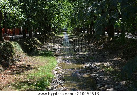 Small Vrnjacka river in Vrnjacka Banja town Serbian spa center in summertime