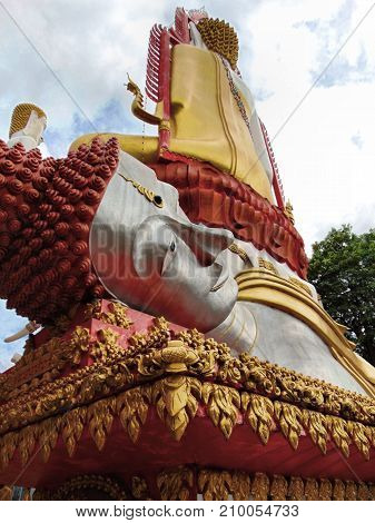 Red and silver, lying Buddha statue in Bangkok