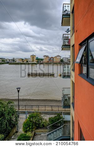 Apartment balconies looking towards the River Thames. Taken on an overcast day.