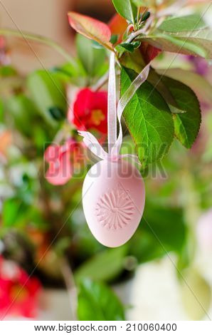 Easter decoration hanging with a pink ribbon